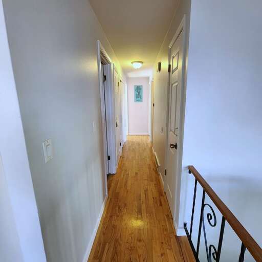 Upstairs hallway view of the upper 3 bedrooms. Upstairs hallway view of the upper 3 bedrooms.
