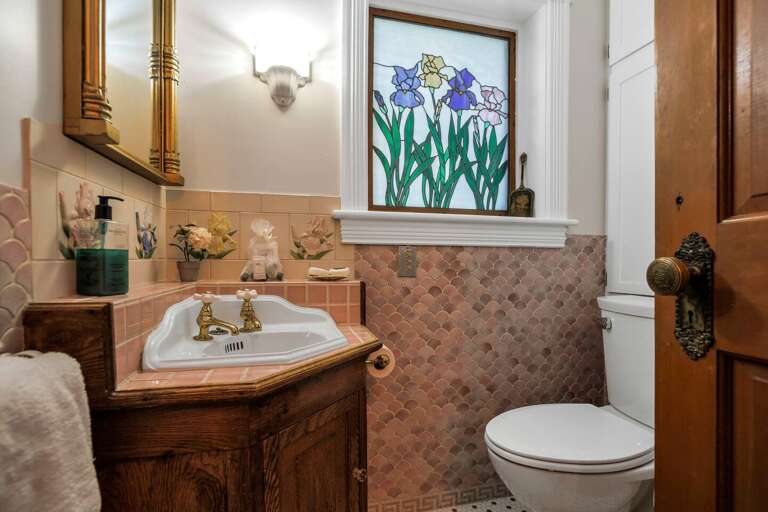 The main-floor bathroom, with a shower, was remodeled in 2024 with a fresh look and updated amenities.