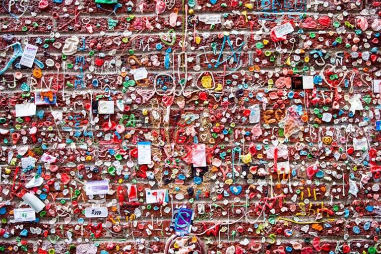 Got gum? The Gum Wall started in the 1990s when patrons and performers at Unexpected Productions stuck their used gum on the wall. Since then, the wall has grown piece by piece to cover an enormous expanse of brick and continues to expand down Post Alley.