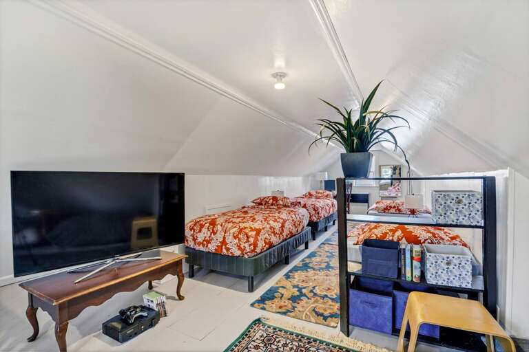 Four twin beds, a dedicated workspace, TV and game console will keep kids entertained for hours!