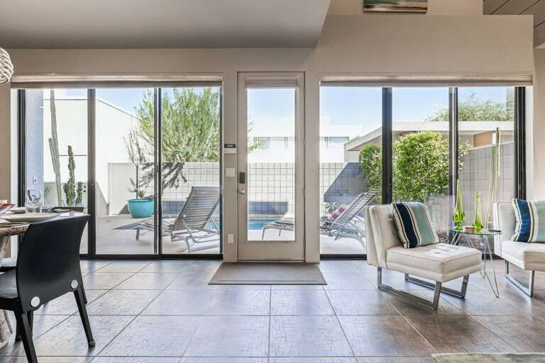 Step into style! This artistic modern living room seamlessly flows to the courtyard and pool, creating an inviting space for relaxation and fun. ️ Enjoy outdoor dining surrounded by lush greenery. Perfect for creating unforgettable memories! Step into style! This artistic modern living room seamlessly flows to the courtyard and pool, creating an inviting space for relaxation and fun. ️ Enjoy outdoor dining surrounded by lush greenery. Perfect for creating unforgettable memories!