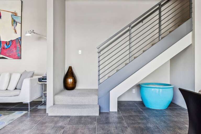 From the dining room, head upstairs to the loft and discover the two additional bedrooms, laundry, and bathrooms. From the dining room, head upstairs to the loft and discover the two additional bedrooms, laundry, and bathrooms.