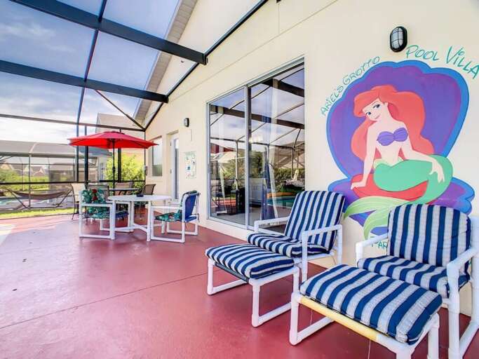 Enjoy outdoor dining and colorful seating in the spacious covered patio area. Enjoy outdoor dining and colorful seating in the spacious covered patio area.