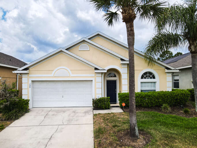 Front view of the home. Tranquil setting with palm trees framing the house. Front view of the home. Tranquil setting with palm trees framing the house.