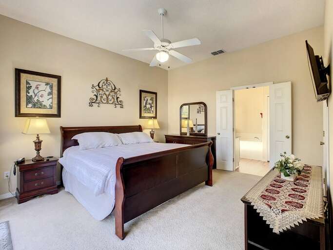 Peaceful master bedroom with plush king bed and ensuite access. Peaceful master bedroom with plush king bed and ensuite access.