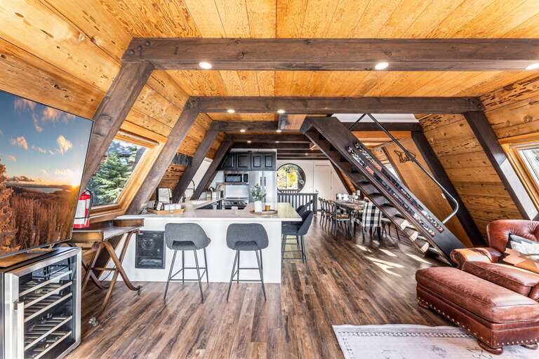 A chef's delight! The gourmet kitchen features sleek countertops, state-of-the-art appliances, perfect for meal prep or casual dining. Seating for 4 around the kitchen. A drip coffee maker is provided.