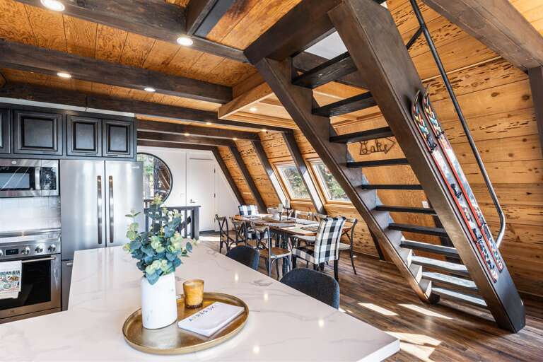 A chef's delight! The gourmet kitchen features sleek countertops, state-of-the-art appliances, perfect for meal prep or casual dining. Seating for 4 around the kitchen. A drip coffee maker is provided.