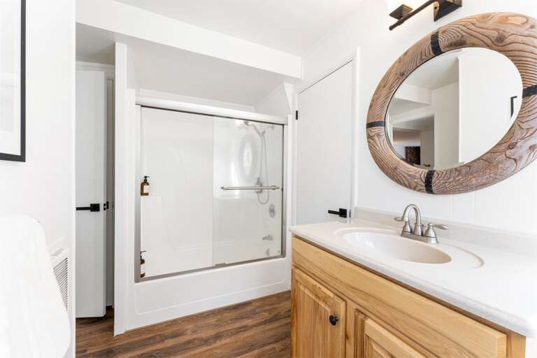 Full bathroom - Located on the first floor. This bathroom features a single vanity and shower/tub combo. Thoughtfully stocked with shampoo, conditioner, body wash, hand soap and toilet paper for a comfortable stay.