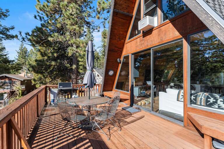 Soak up the sun from the back deck! Enjoy the private hot tub, patio table and BBQ grill. Plus there is a ping pong table underneath the deck.