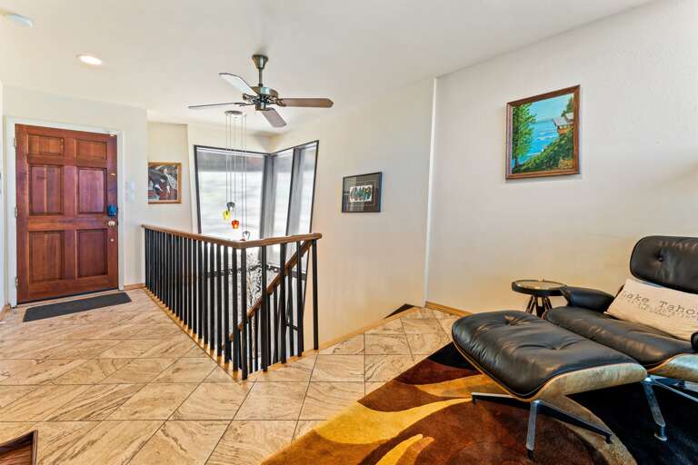 Upstairs Landing - Front Door and Stairs pictured