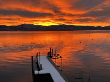 Enjoy the sunsets from the private dock, where the sky lights up in shades of gold and pink over the lake.