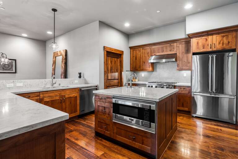A chef's delight! The gourmet kitchen features sleek countertops, state-of-the-art appliances, and an island perfect for meal prep or casual dining.