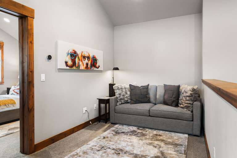Upstairs landing area with a pull out sofa. Upstairs landing area with a pull out sofa.