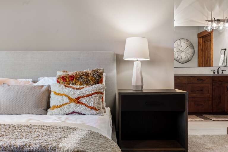 This luxurious upstairs master suite features a plush king bed, a 49" Smart TV, and an en-suite bathroom, offering a serene retreat perfect for unwinding after a day of Tahoe adventures. This luxurious upstairs master suite features a plush king bed, a 49" Smart TV, and an en-suite bathroom, offering a serene retreat perfect for unwinding after a day of Tahoe adventures.