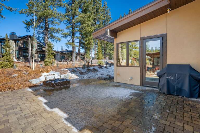 The backyard patio with gas fire pit and BBQ grill. Please note, patio furniture is stored from November to April. 