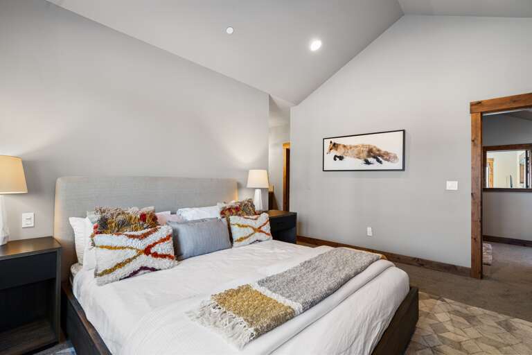 This luxurious upstairs master suite features a plush king bed, a 49" Smart TV, and an en-suite bathroom, offering a serene retreat perfect for unwinding after a day of Tahoe adventures. This luxurious upstairs master suite features a plush king bed, a 49" Smart TV, and an en-suite bathroom, offering a serene retreat perfect for unwinding after a day of Tahoe adventures.