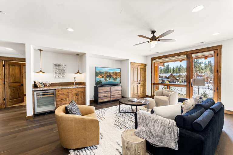 Enjoy movie nights on the 70" Smart TV or game time in this cozy entertainment area, designed for relaxation and fun with friends and family.