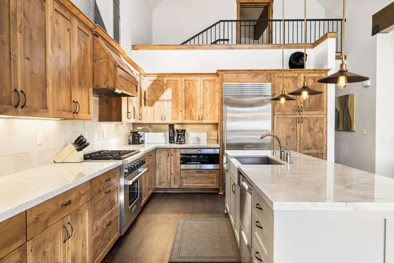 A chef's delight! The gourmet kitchen features sleek countertops, state-of-the-art appliances, and an island perfect for meal prep or casual dining. A chef's delight! The gourmet kitchen features sleek countertops, state-of-the-art appliances, and an island perfect for meal prep or casual dining.