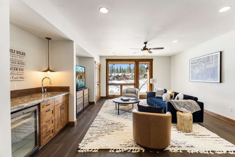 Enjoy movie nights on the 70" Smart TV or game time in this cozy entertainment area, designed for relaxation and fun with friends and family. Enjoy movie nights on the 70" Smart TV or game time in this cozy entertainment area, designed for relaxation and fun with friends and family.