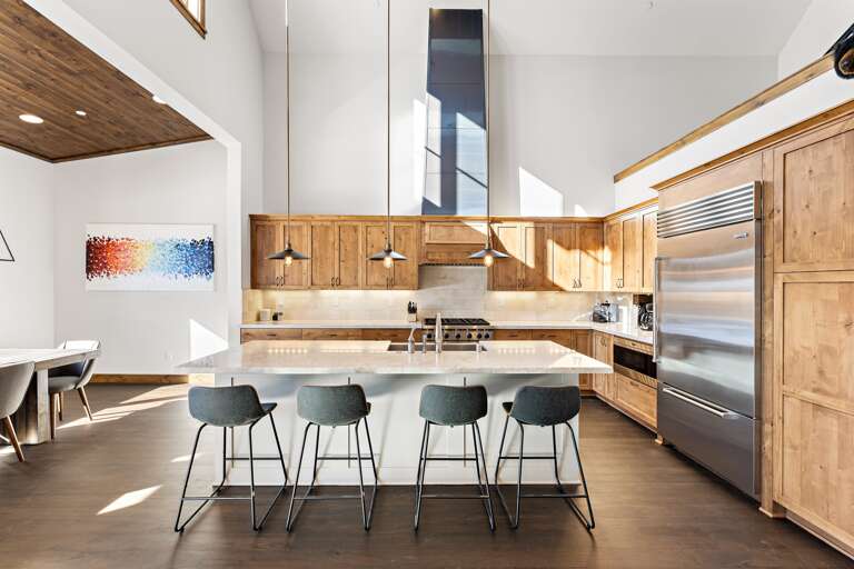 A chef's delight! The gourmet kitchen features sleek countertops, state-of-the-art appliances, and an island perfect for meal prep or casual dining.