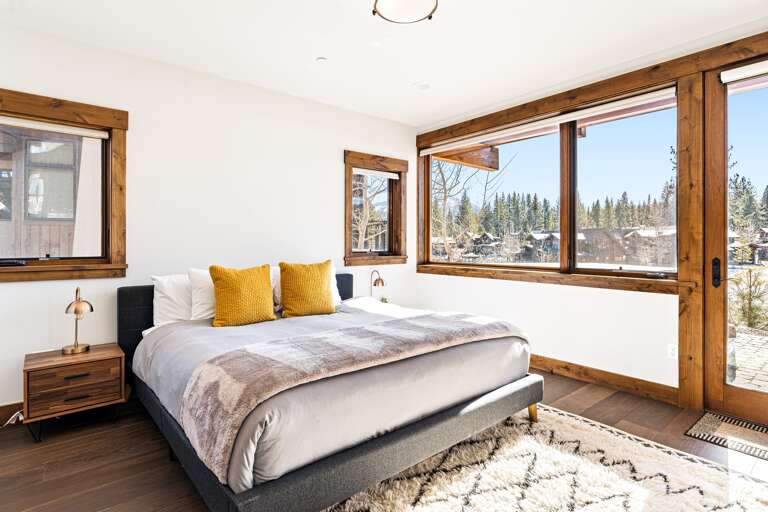 This downstairs bedroom features a plush king bed, offering ultimate comfort. Enjoy stunning views right from your room and step outside to the lower patio, where a private hot tub awaits for a relaxing soak amidst the beauty of Schaffer's Mill. This downstairs bedroom features a plush king bed, offering ultimate comfort. Enjoy stunning views right from your room and step outside to the lower patio, where a private hot tub awaits for a relaxing soak amidst the beauty of Schaffer's Mill.