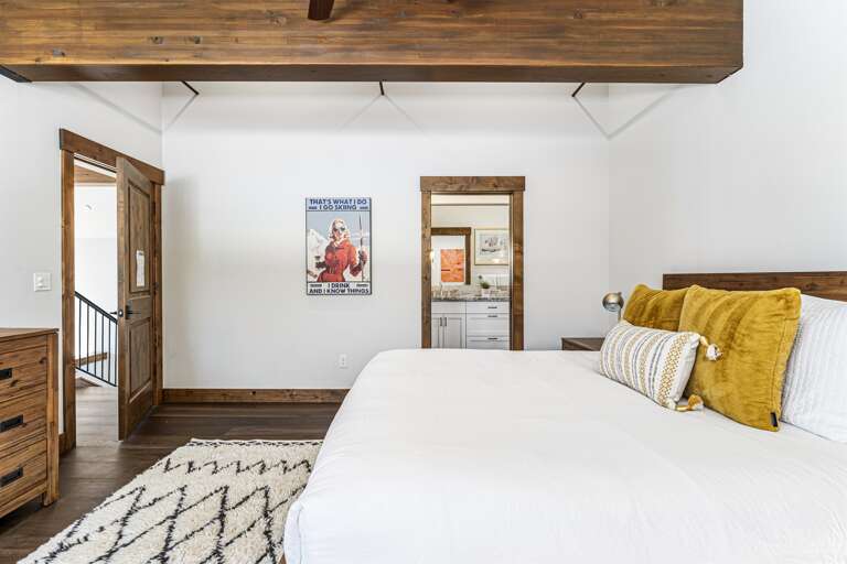 The luxurious master suite boasts a plush king bed and an en-suite bathroom, making it a serene retreat after a day of Tahoe adventures. The luxurious master suite boasts a plush king bed and an en-suite bathroom, making it a serene retreat after a day of Tahoe adventures.