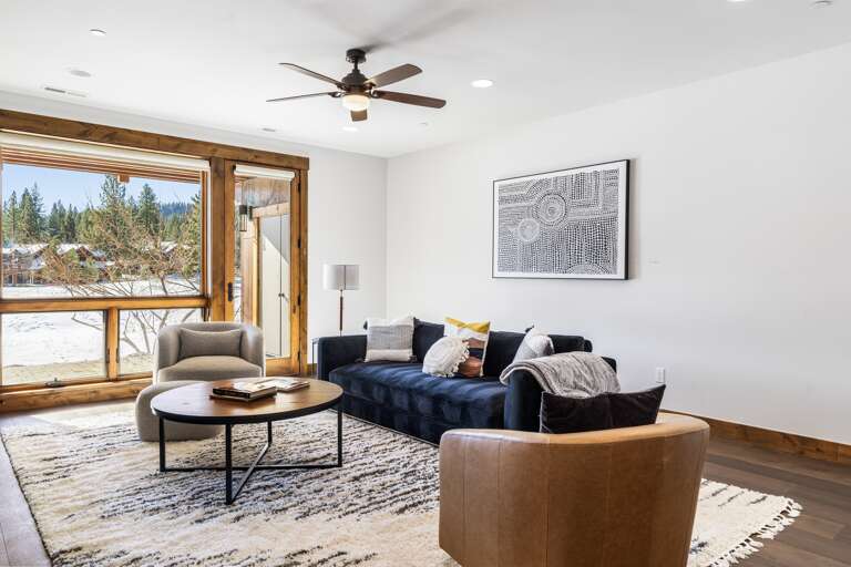 Enjoy movie nights on the 70" Smart TV or game time in this cozy entertainment area, designed for relaxation and fun with friends and family. The couch converts to a sleeper sofa. Enjoy movie nights on the 70" Smart TV or game time in this cozy entertainment area, designed for relaxation and fun with friends and family. The couch converts to a sleeper sofa.