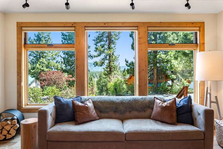 Cozy up in the heart of the home, floor-to-ceiling windows, 65" Smart TV and a wood-burning fireplace set the mood for your mountain escape. Whether it’s morning coffee or après-ski wine, this is the place to be.