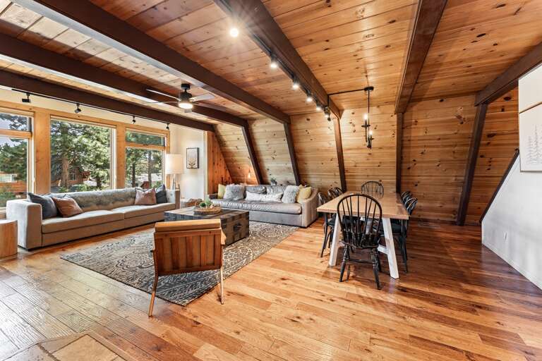Cozy up in the heart of the home, floor-to-ceiling windows, 65" Smart TV and a wood-burning fireplace set the mood for your mountain escape. Whether it’s morning coffee or après-ski wine, this is the place to be.