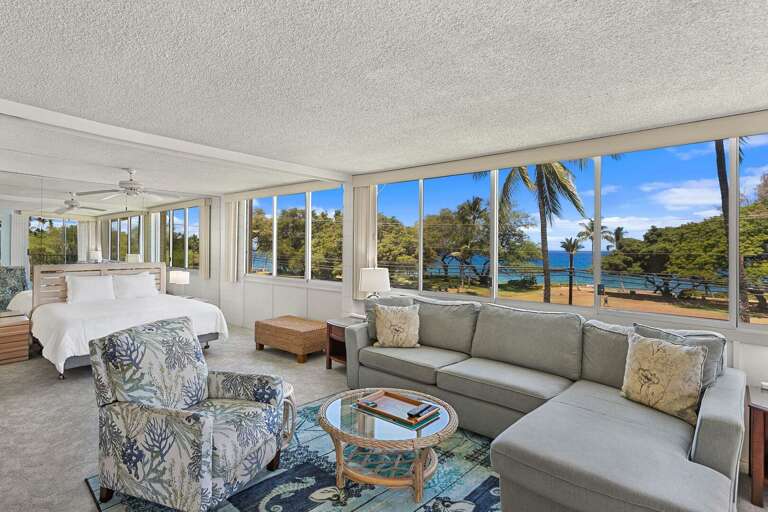 Beachfront Living Room With Large Windows And Sea View
