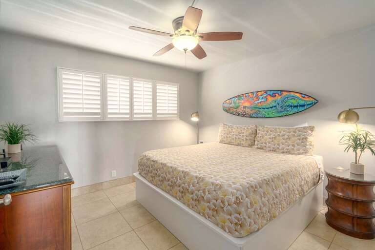 Bright Bedroom With Large Bed And Ceiling Fan