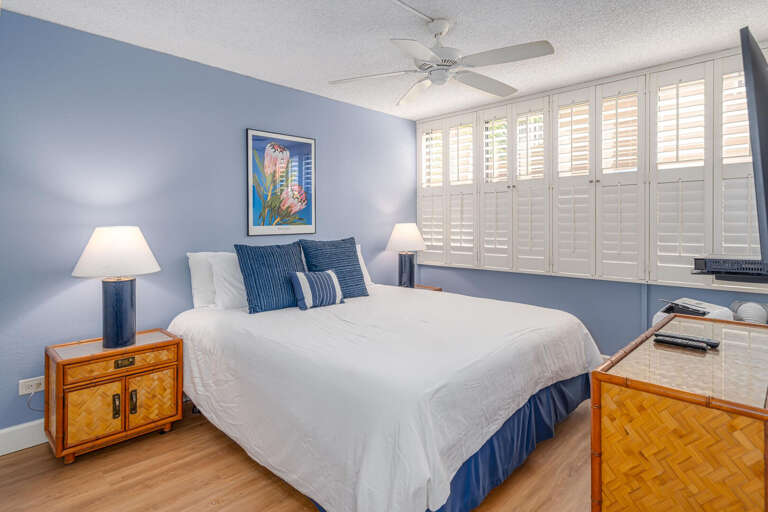 Interior Of A Bedroom With Blue Walls And White Bed Linen