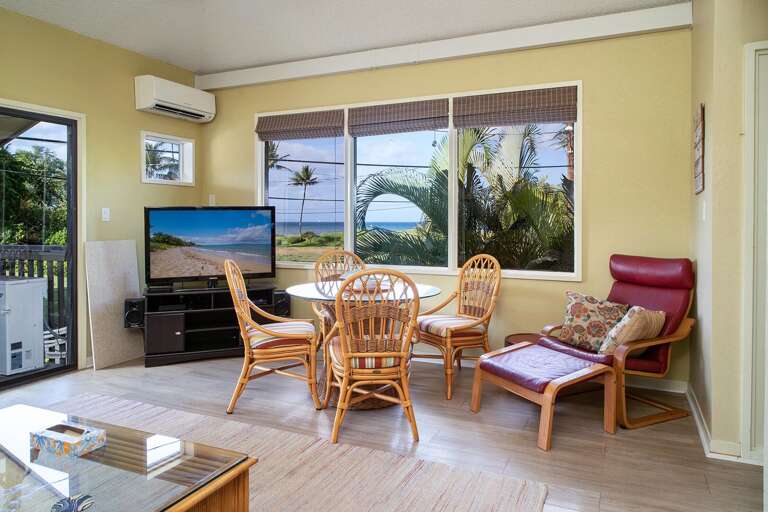Living Room Interior With Furniture And Ocean View Through Windows