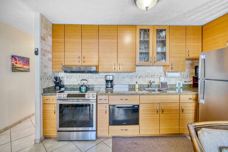 Kitchen Interior With Wooden Cabinets And Stainless Steel Appliances