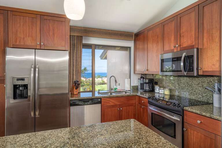 Residential Kitchen Interior With Stainless Steel Appliances And Wooden Cabinets Residential Kitchen Interior With Stainless Steel Appliances And Wooden Cabinets