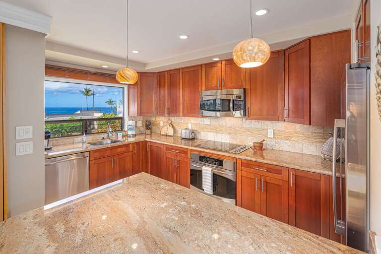 Kitchen Interior With Wooden Cabinets And Ocean View