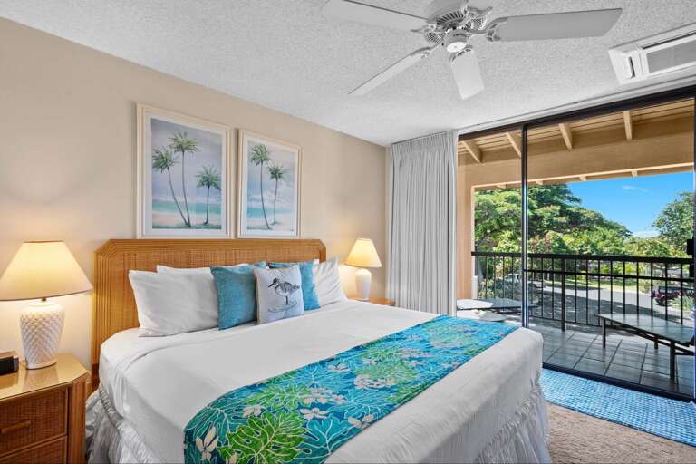 Bedroom With Balcony Breeze, Blue Bedding, And Bright Backdrop