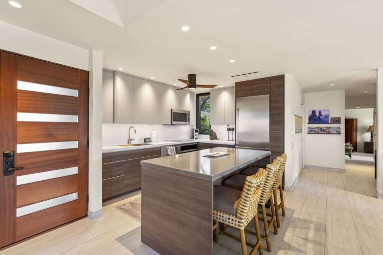 Vacation Rental View Of Kitchen With Sleek Surfaces And Spacious Seating