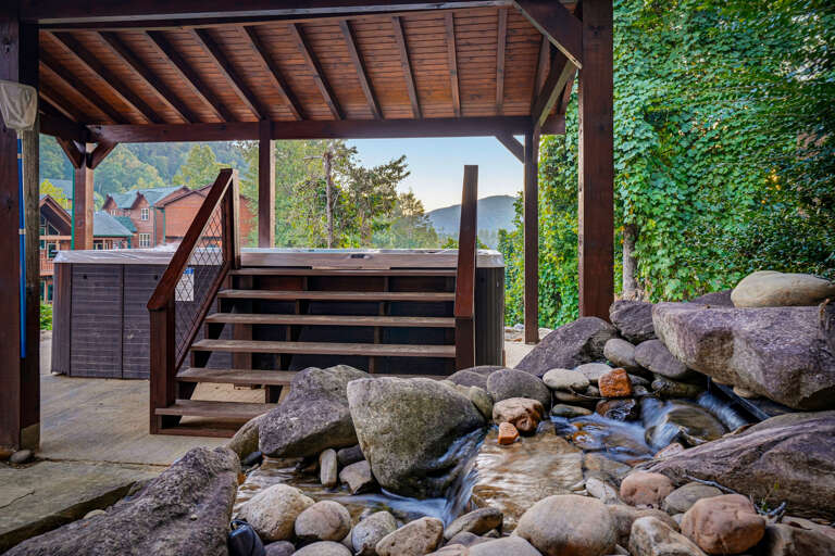 Outdoor pavilion with waterfall feature