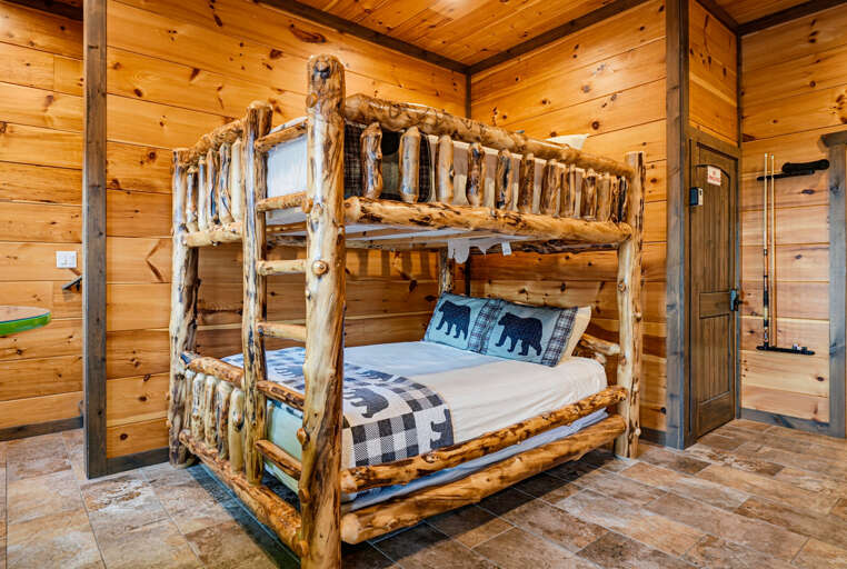 Queen-over-queen bunk located in the game room