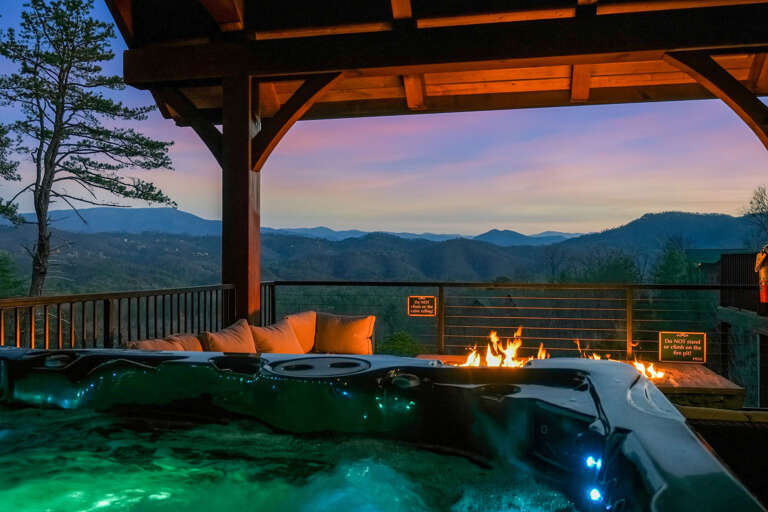 Twilight Terrace With Bubbling Hot Tub And Flickering Fire Pit