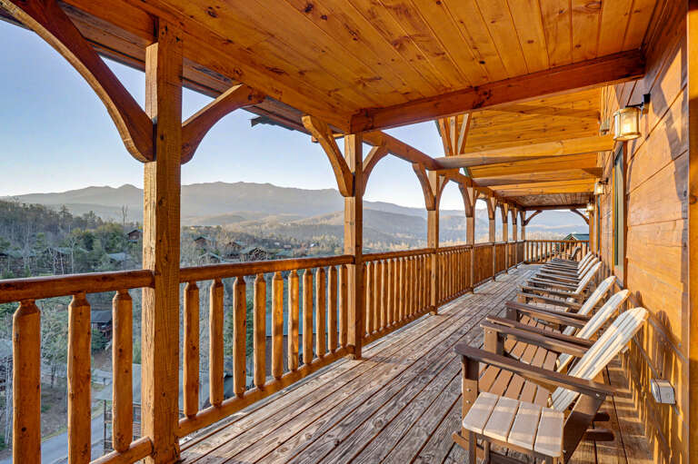 Wooden Veranda With Valley View And Arranged Chairs