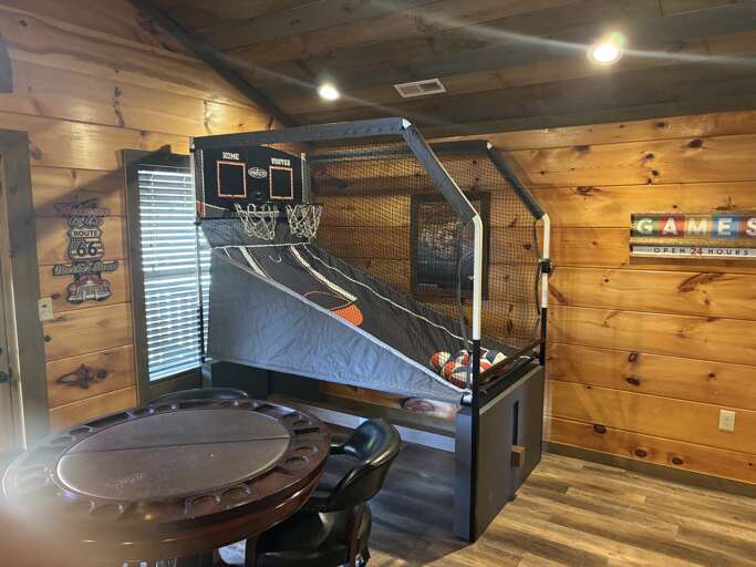 Game Room With Basketball Arcade And Poker Table