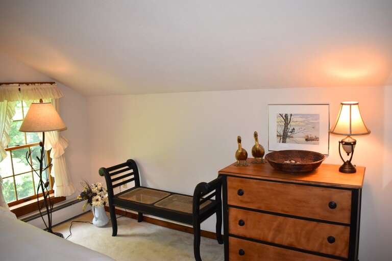 Upstairs queen sitting and storage area