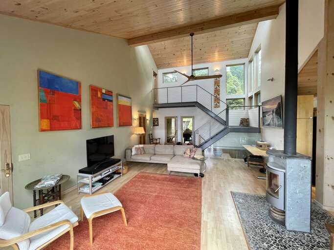 Living room Looking At Main Entrance and Stairs to Upper Level