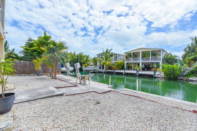 Vacation Rental Villa View Of Vivid Waters And Lush Landscape