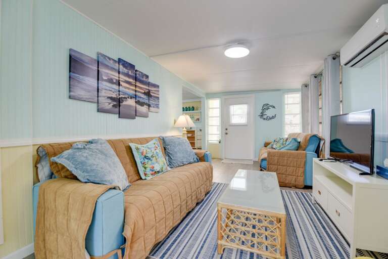 Light Blue Living Space, Striped Snug Sofas, Sailing-themed Decor