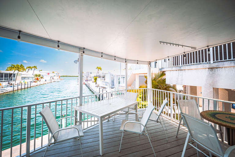 Bright Balcony Beside Blue Bay, Vacation Rental View With Chairs