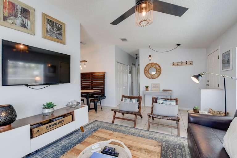 Visually Vibrant Vacation Rental: Spacious Sitting Space, Suspended Screen, Circular Ceiling Fan, And Subtle Sea-themed Style Visually Vibrant Vacation Rental: Spacious Sitting Space, Suspended Screen, Circular Ceiling Fan, And Subtle Sea-themed Style