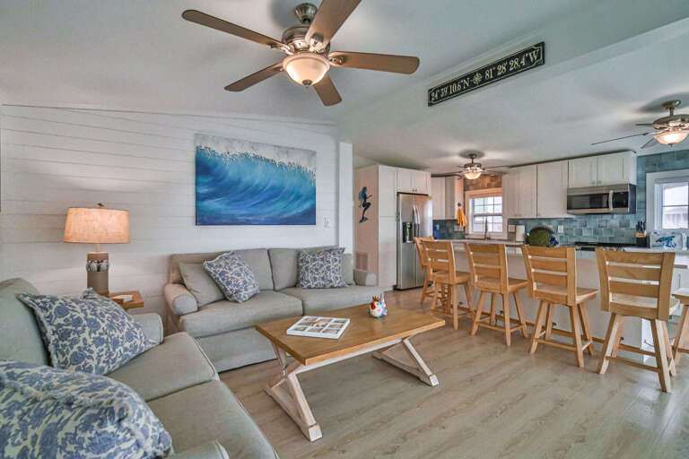 Bright Beach-themed Living Space With Sea Wave Wall Art In Vacation Rental Bright Beach-themed Living Space With Sea Wave Wall Art In Vacation Rental